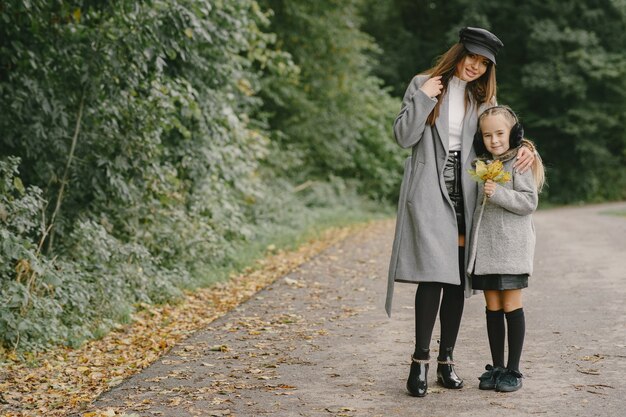 Free Photo | Fashionable mother with daughter. people walks outside ...