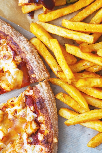 Fast food pizza fried potato close up Premium Photo