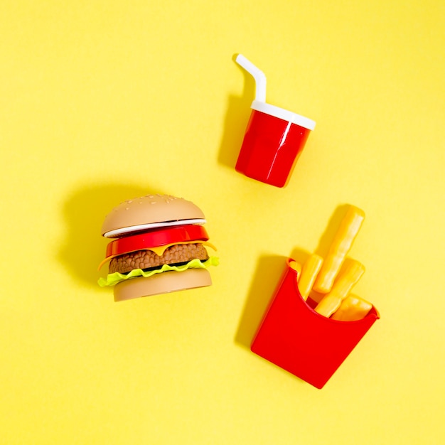 Download Free Photo Fast Food Replicas On Yellow Background PSD Mockup Templates