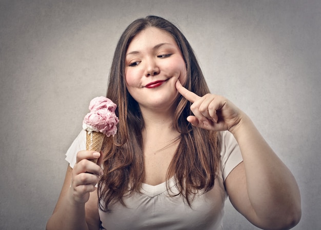 Premium Photo | Fat woman smiling at an ice cream