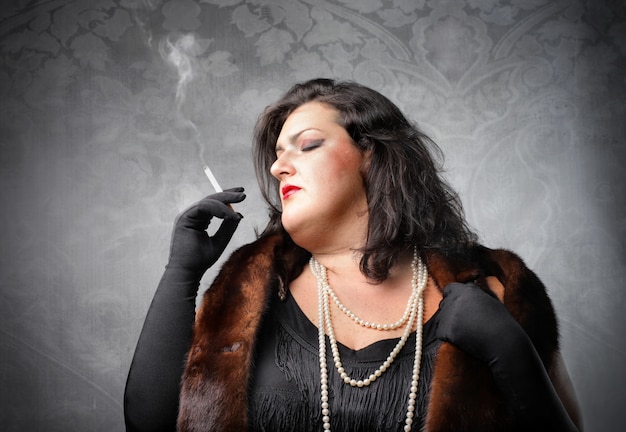 Fat Woman Smoking Premium Photo
