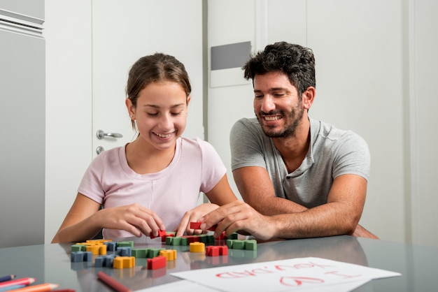 Father and daughter painting together on fathers day | Free Photo