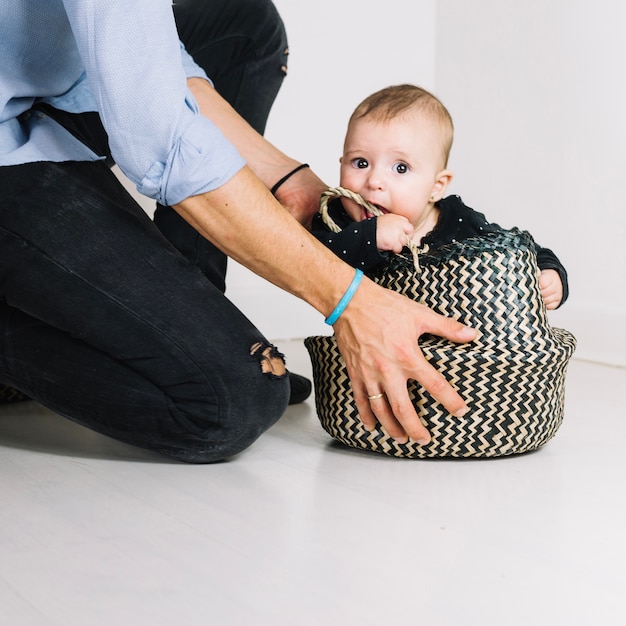 baby holding basket