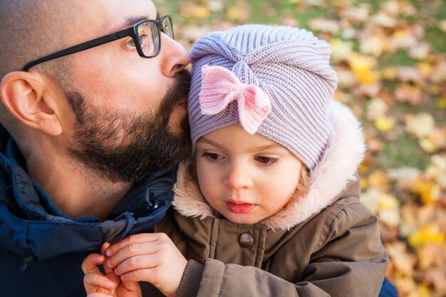 Premium Photo Father Hugging And Kissing His Cute Little Daughter