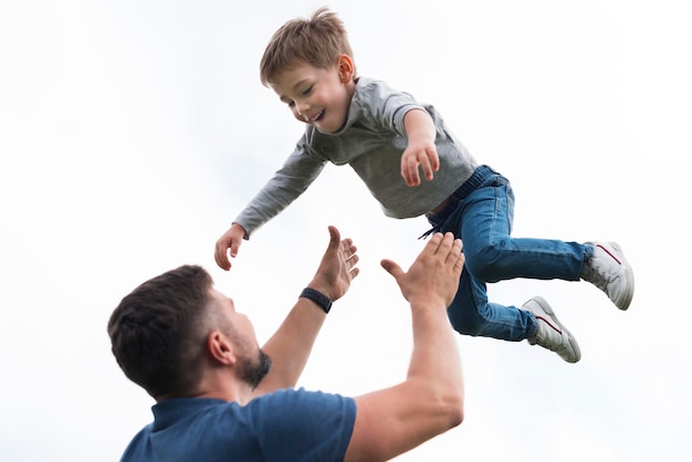 Free Photo Father And Son Playing Low View