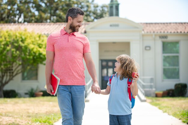 premium-photo-father-and-son-walking-trough-school-park-father-and