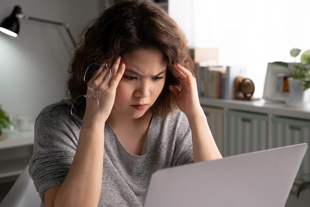 Premium Photo | Feeling tired and stressed. young asian woman sitting ...