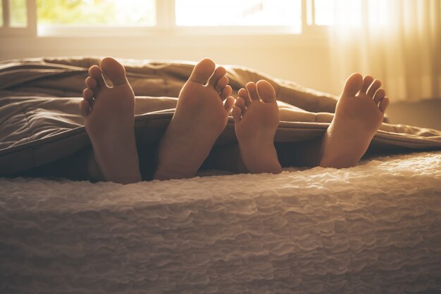 Premium Photo | Feet out of the blanket