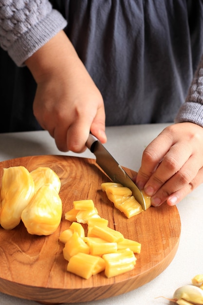 Premium Photo Female Asian Hand Slicing Diced Yellow Ripe Jackfruit