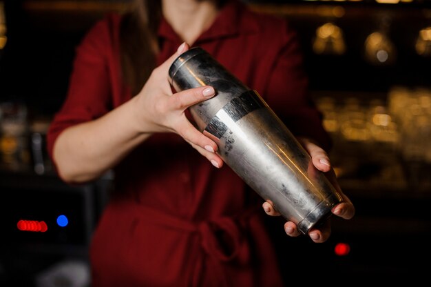 Premium Photo Female Bartender Dressed In A Burgundy Shirt Shaking A