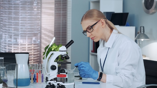 Premium Photo | Female chemistry professor in lab coat.