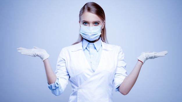 Female Doctor In Medical Protective Mask And Nitrile Latex Gloves