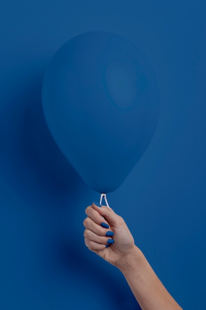 Free Photo | Female hand holding balloon