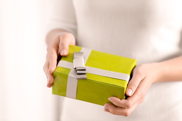 Premium Photo Female Hands Holding Gift Box Closeup