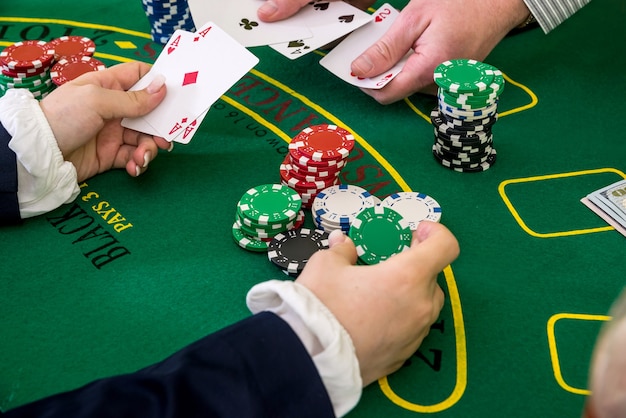 Premium Photo Female Hands Reaching For Poker Chips Play Card In Casino