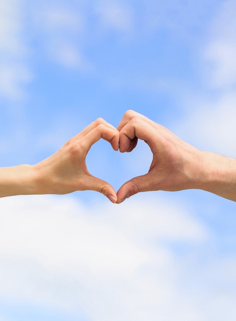 Premium Photo Female And Man Hands In The Form Of Heart Against The Sky Hands In Shape Of Love Heart Heart From Hands On A Sky Background