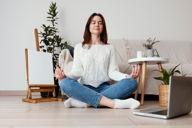 Female meditating indoor portrait Free Photo