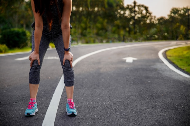 Premium Photo | Female runner athlete knee injury and pain. woman ...