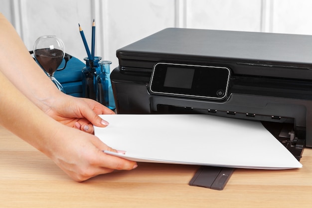 Premium Photo | Female secretary making photocopies on xerox machine in ...