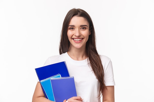 Female student with books and paperworks Free Photo