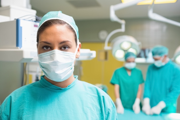 Premium Photo | Female surgeon posing with her uniform