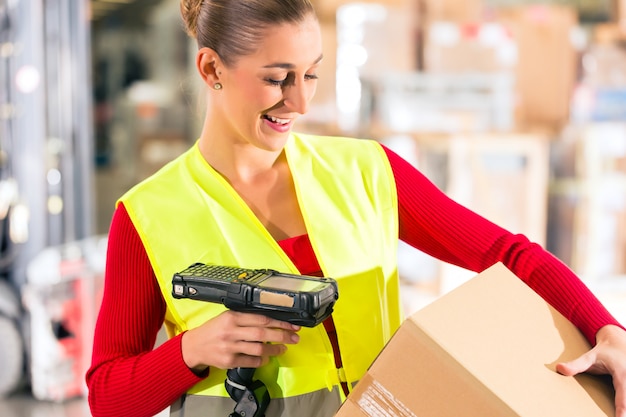 Premium Photo | Female worker with protective vest and scanner, scans