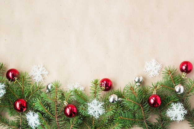 Festive christmas border with red and silver balls on fir branches and ...