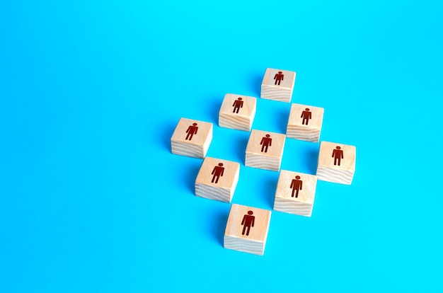 Premium Photo | Figures blocks of people on a blue background. concept ...