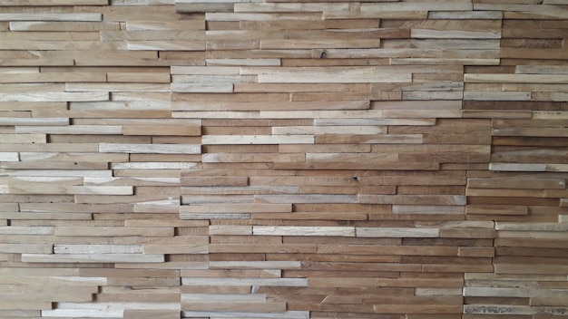 Premium Photo | Fine wood blocks on a wall for background.