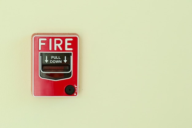 Premium Photo | Fire alarm system install on the wall.