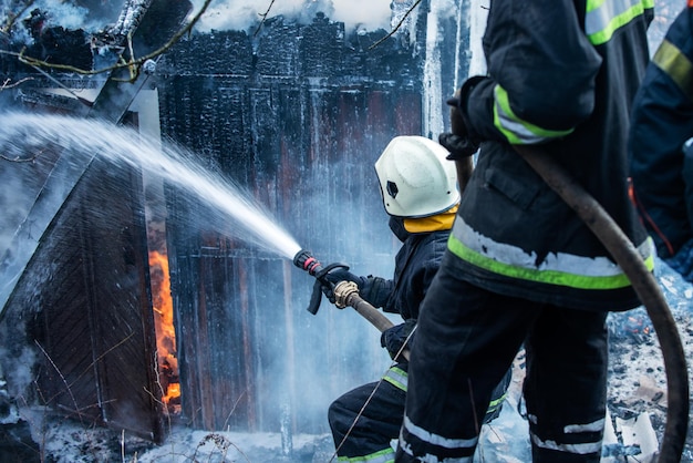 Premium Photo Fire Fighters Putting Out A House Fire