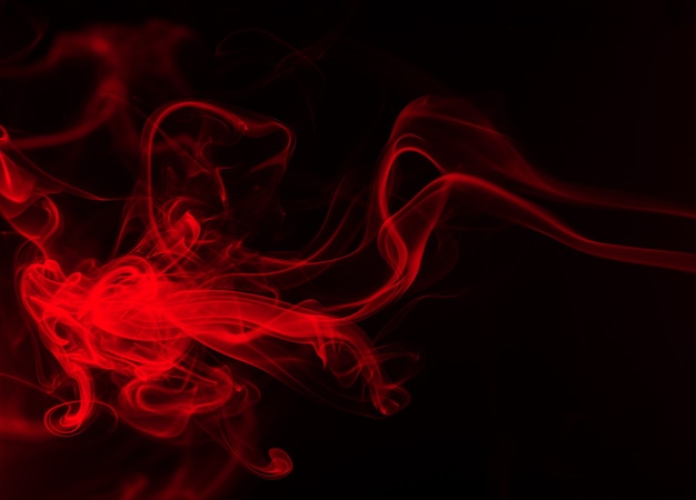 黒の背景 闇の概念に抽象的な赤い煙の火 プレミアム写真