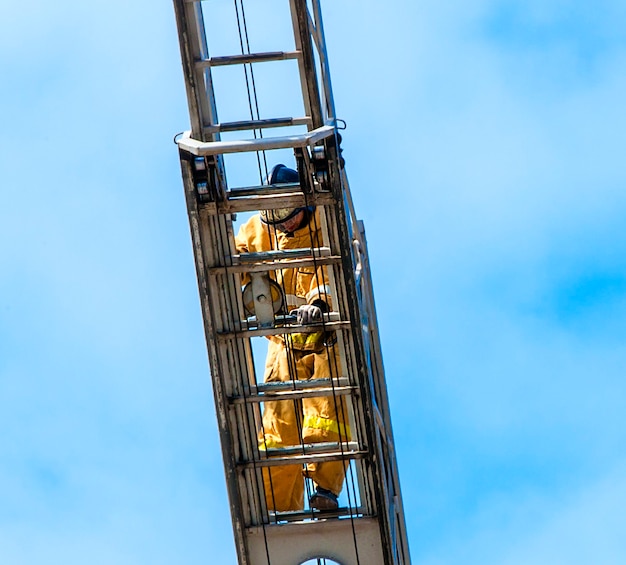 Premium Photo | Firefighter In Training Climb With The Fire Stairs.