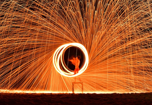 Premium Photo Fireman Show On The Beach With Swing Fire Sparks In The Premium Photo Fireman Show On The Beach With Swing Fire Sparks In The