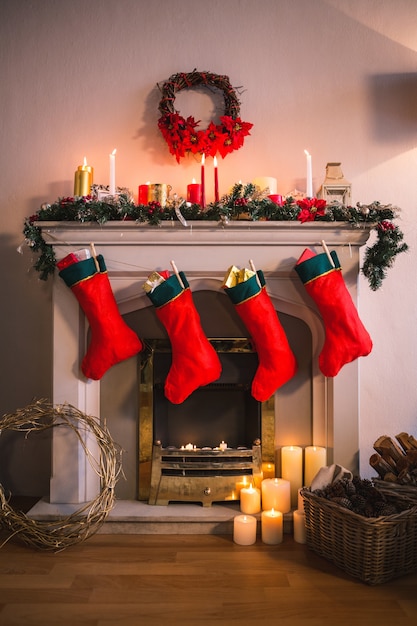 Free Photo | Fireplace decorated with christmas motifs and red socks