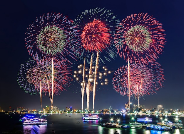 Fireworks over cityscape by the beach and sea for celebrating new year and  special holidays | Premium Photo