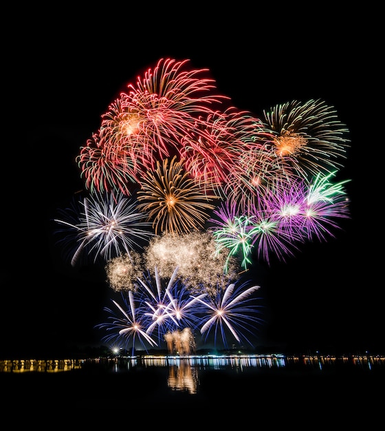 Premium Photo Fireworks at river, lake or ocean for new year or