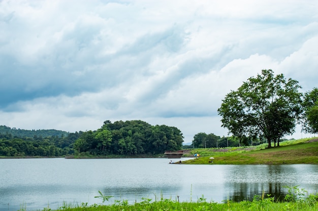 Premium Photo | Fishermen sit fishing at the huai pa daeng reservoir