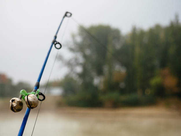 Premium Photo | Fishing rod with bells to alert about the bite in the ...