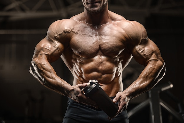 Premium Photo | Fitness man drinking water after workout