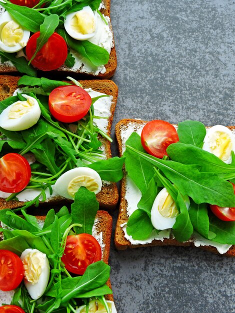 Premium Photo | Fitness toasts with arugula, cream cheese, cherry ...