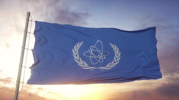 Premium Photo | Flag Of International Atomic Energy Agency Iaea Waving ...