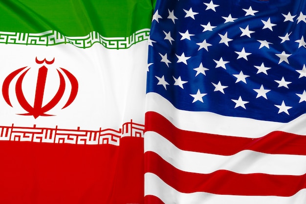 Premium Photo | Flag of iran together with flag of the united states of ...