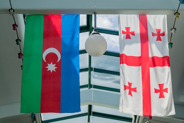 Flags Of Georgia And Azerbaijan Hanging On The Ceiling Photo