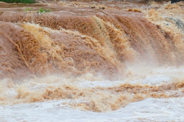 Flash flood fast water come through flash flood the impact of global warming Premium Photo