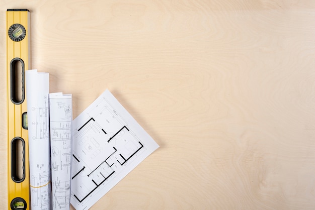 Flat lay architectural plans on desk with copy-space Free Photo