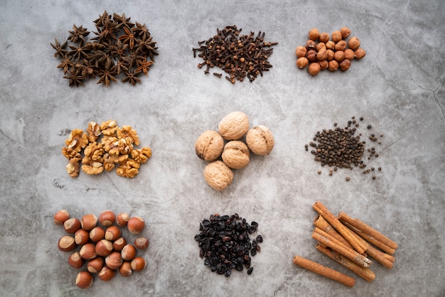 Flat lay arrangement with nuts on stucco background Free Photo