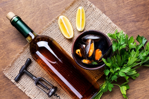 Free Photo | Flat-lay boiled mussels and wine bottle