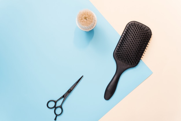 Flat Lay Composition With Professional Hairdresser Tools On Pastel