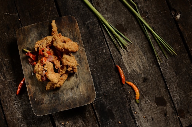 Premium Photo Flat Lay Crispy Fried Chicken Pieces And Balinese Sambal Matah On A Wooden Table 2450